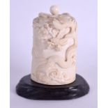 A 19TH CENTURY JAPANESE MEIJI PERIOD CARVED IVORY TUSK VASE AND COVER decorated with dragons