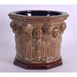 A RARE DOULTON LAMBETH STONEWARE POTTERY FONT incised W T L & S 1931, decorated in relief with