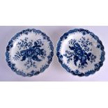 18th c. Worcester pair of blue and white plates with an elaborate painted border enclosing the