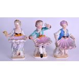 A GROUP OF THREE 19TH CENTURY MEISSEN PORCELAIN TABLE SALT modelled as figures holding aloft open