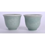 A PAIR OF 19TH CENTURY CHINESE CELADON TEABOWLS Qing, decorated with lingzhi fungus. 6.25 cm wide.