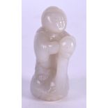 AN UNUSUAL 19TH CENTURY CHINESE CARVED WHITE JADE FIGURE OF A YOUNG BOY modelled riding upon a swan.