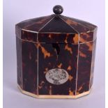 A LATE GEORGE III SILVER IVORY AND TORTOISESHELL TEA CADDY AND COVER inset with an engraved silver