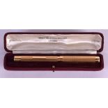 A CASED YELLOW MABIE TODD & CO SWAN SELF FILLING PEN. 21 grams.