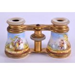 A PAIR OF MID 19TH CENTURY FRENCH VIENNA ENAMEL OPERA GLASSES with mother of pearl fittings. 9.5