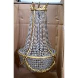 A GOOD ANTIQUE CHANDELIER, formed with spherical facetted glass droplets and ormolu floral swag