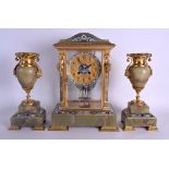 A 19TH CENTURY FRENCH ONYX AND CHAMPLEVE ENAMEL CLOCK GARNITURE decorated with extensive foliage and