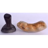 AN EARLY STONE AGE PESTLE together with an unusual hand held white stone tool. Pestle 10 cm high,