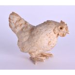 A 19TH CENTURY JAPANESE MEIJI PERIOD CARVED IVORY OKIMONO in the form of a standing hen. 6.5 cm x