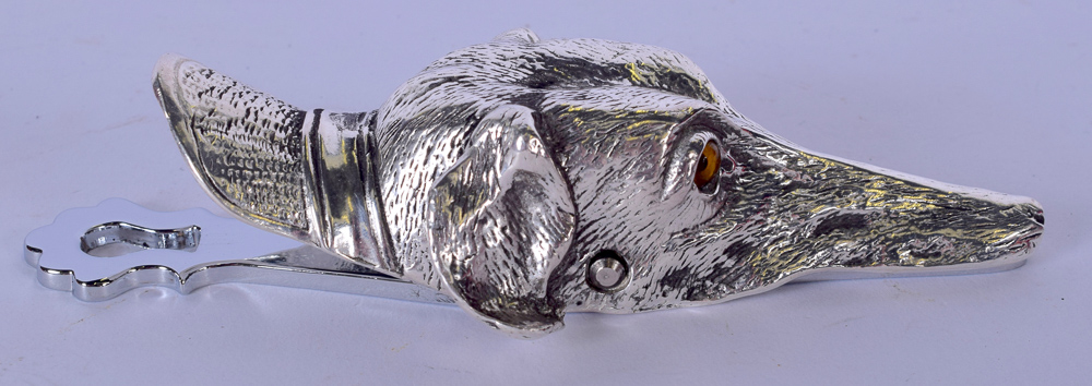 A SILVER PLATED LETTER CLIP, formed as a dog head. 15 cm wide.