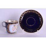 Sevres coffee cup and saucer painted with two winged cherubs a crown and initials LP for Louis