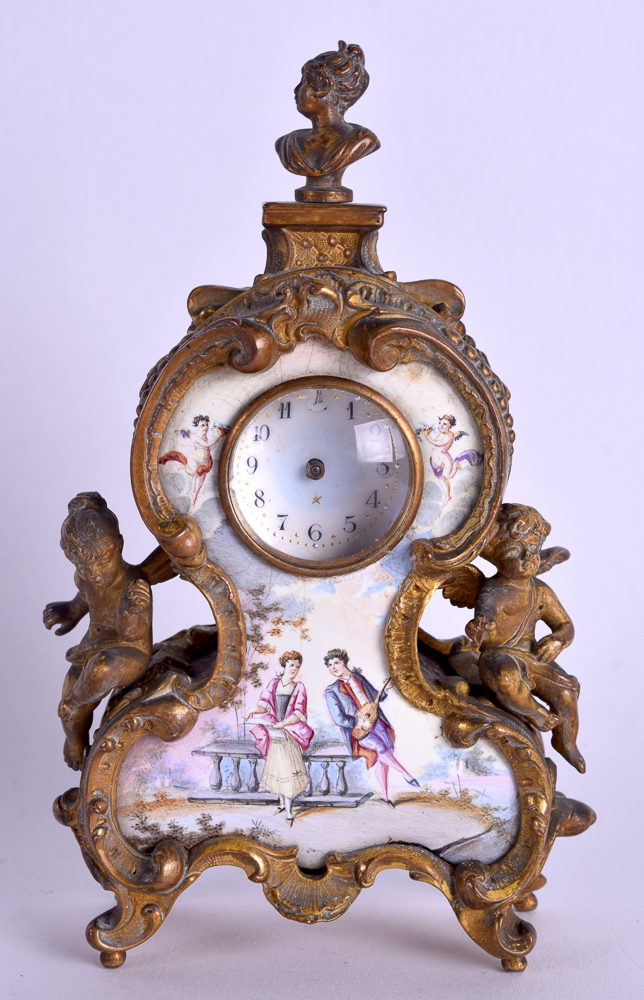 A 19TH CENTURY AUSTRIAN VIENNA ENAMEL AND BRONZE DESK CLOCK of small proportions, painted with