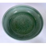 A LARGE MING STYLE CELADON GLAZED POTTERY BOWL, decorated with foliage. 35 cm wide.