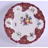 A GOOD 18TH CENTURY WORCESTER SCALLOPED PLATE painted with fruit under a claret ground, possibly