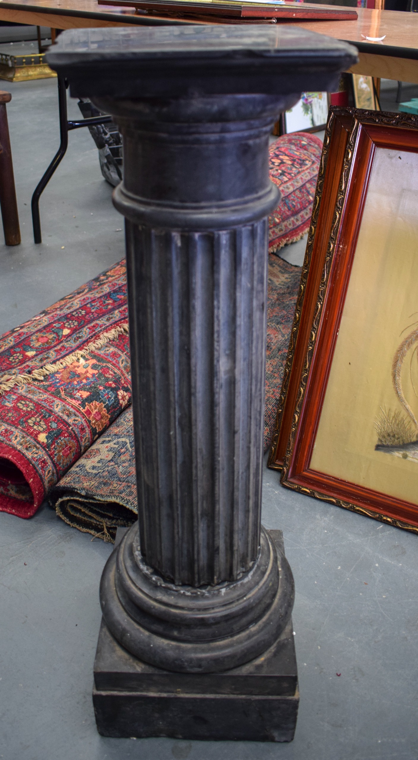 AN EARLY 20TH CENTURY SLATE CORINTHIAN COLUMN, formed on a stepped pedestal base. 81 cm high.