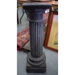 AN EARLY 20TH CENTURY SLATE CORINTHIAN COLUMN, formed on a stepped pedestal base. 81 cm high.