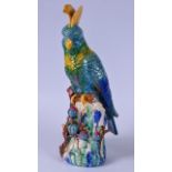 A LARGE PORCELIAN FIGURE OF A CRESTED COCKATOO, in the Majolica style, modelled upon a
