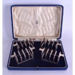 A CASED SET OF FOUR ART DECO SILVER TOAST RACKS. Sheffield 1937. 8 oz. (4)