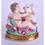 A 19TH CENTURY CONTINENTAL PORCELAIN PILL BOX Meissen style, modelled as a putti holding a lamb. 4.5