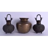 A PAIR OF 19TH CENTURY INDIAN SWING HANDLED BRONZE VASES decorated with birds and flowers,