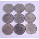 A COLLECTION OF NINE CHINESE SILVER COINS of various designs. 20.5 grams each. (9)