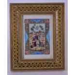 AN EARLY 20TH CENTURY PERSIAN IVORY PANEL IN A MICRO MOSAIC FRAME, hand painted with detailed battle