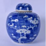 A LARGE 19TH CENTURY CHINESE BLUE AND WHITE PORCELAIN GINGER JAR AND COVER, painted with prunus.