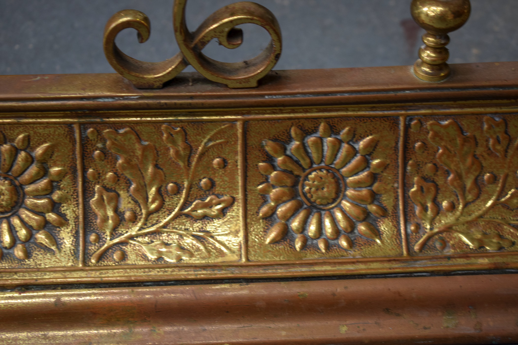 AN EARLY 20TH CENTURY ARTS AND CRAFTS COPPER AND BRASS FENDER, decorated with panels of flowers, - Image 2 of 4