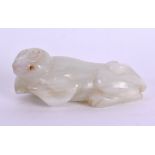 AN EARLY 20TH CENTURY CHINESE CARVED JADE FIGURE OF A MONKEY modelled reclining. 6 cm x 2 cm.