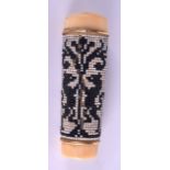 A VERY RARE EARLY 19TH CENTURY CARVED IVORY BEAD WORK CANE HANDLE decorated with opposing dragons.