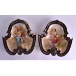 A FINE AND RARE PAIR OF 19TH CENTURY VIENNA PORCELAIN PLAQUES of highly unusual form, painted with