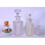 A REGENCY CUT GLASS BOTTLE AND STOPPER, together with three others. Largest 21 cm.
