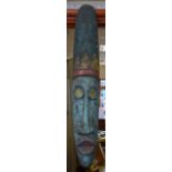 A LARGE TRIBAL WOODEN MASK,, carved with an elongated face, possibly Indonesian. 93 cm high.