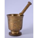 AN EARLY 20TH CENTURY HEAVY BRONZE PESTLE AND MORTAR, engraved with Eastern scenes depicting a camel