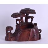 A 19TH CENTURY CHINESE CARVED HARDWOOD BRUSH WASHER Qing, of naturalistic form, with over hanging