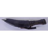 AN EARLY 20TH CENTURY HORN HANDLED MIDDLE EASTERN JAMBIYA DAGGER, possibly rhinoceros, contained