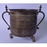A LARGE 19TH CENTURY ISLAMIC BRONZE TWIN HANDLED POT, decorated with floral inspired decoration.