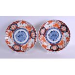 A PAIR OF 19TH CENTURY JAPANESE MEIJI PERIOD IMARI SCALLOPED DISHES painted with floral sprays. 22