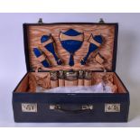 A 1950'S TRAVELLING VANITY CASE, including chrome top bottles and set of brushes. 49 cm wide.