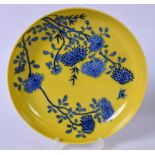 A CHINESE YELLOW GROUND PORCELAIN DISH BEARING YONGZHENG MARKS, decorated with foliage and contained