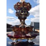 A RARE LARGE 19TH CENTURY BOHEMIAN RUBY GLASS CANDLESTICK of highly unusual form, overlaid with