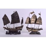 A PAIR OF 19TH CENTURY CHINESE WHITE METAL JUNK BOATS modelled upon hardwood bases. Silver 17 cm x