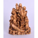 A LARGE 19TH CENTURY JAPANESE MEIJI PERIOD CARVED IVORY NETSUKE formed as numerous figures holding
