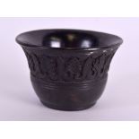 AN EARLY MIDDLE EASTERN ISLAMIC CARVED TERRACOTTA BOWL engraved with acanthus type motifs. 4.75 cm