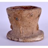 AN EARLY CENTRAL ASIAN TERRACOTTA POTTERY MORTAR with sparse turquoise decoration. 11.5 cm x 10 cm.