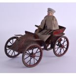 A LOVELY ANTIQUE TIN PLATE WIND UP AUTOMATON CARRIAGE possibly by Bing, unusually modelled as a male