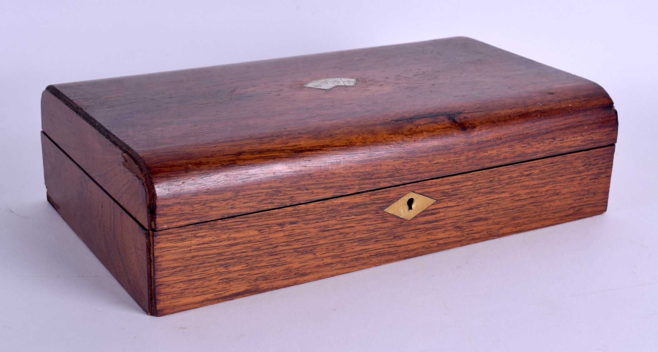 A LATE VICTORIAN/EDWARDIAN SILVER INLAID OAK GAMING BOX the top rising to reveal boxes & gaming