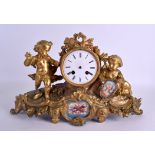 A 19TH CENTURY FRENCH GILT BRONZE SEVRES PORCELAIN MANTEL CLOCK formed with putti holding aloft