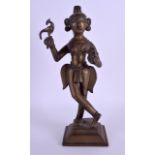 AN 18TH CENTURY INDIAN BRONZE FIGURE OF A STANDING DEITY modelled holding a Buddhistic ritual vessel