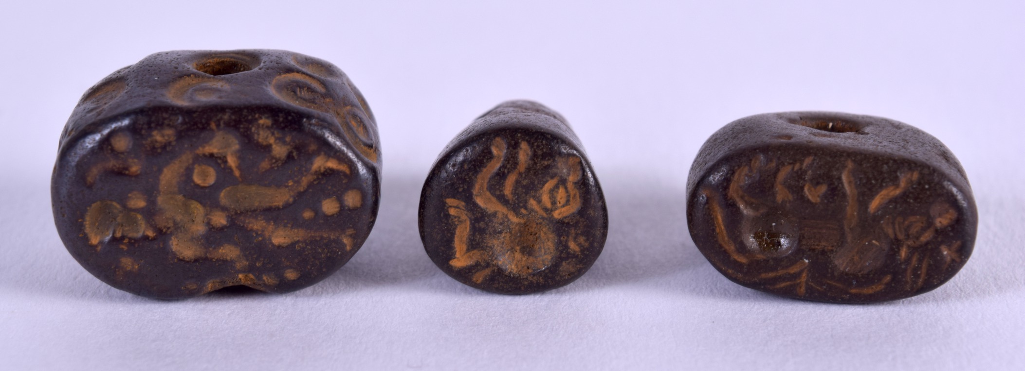 A UNUSUAL EGYPTIAN CARVED AND PAINTED WOODEN AMULET together with three Central Asian seals. (4) - Image 3 of 3